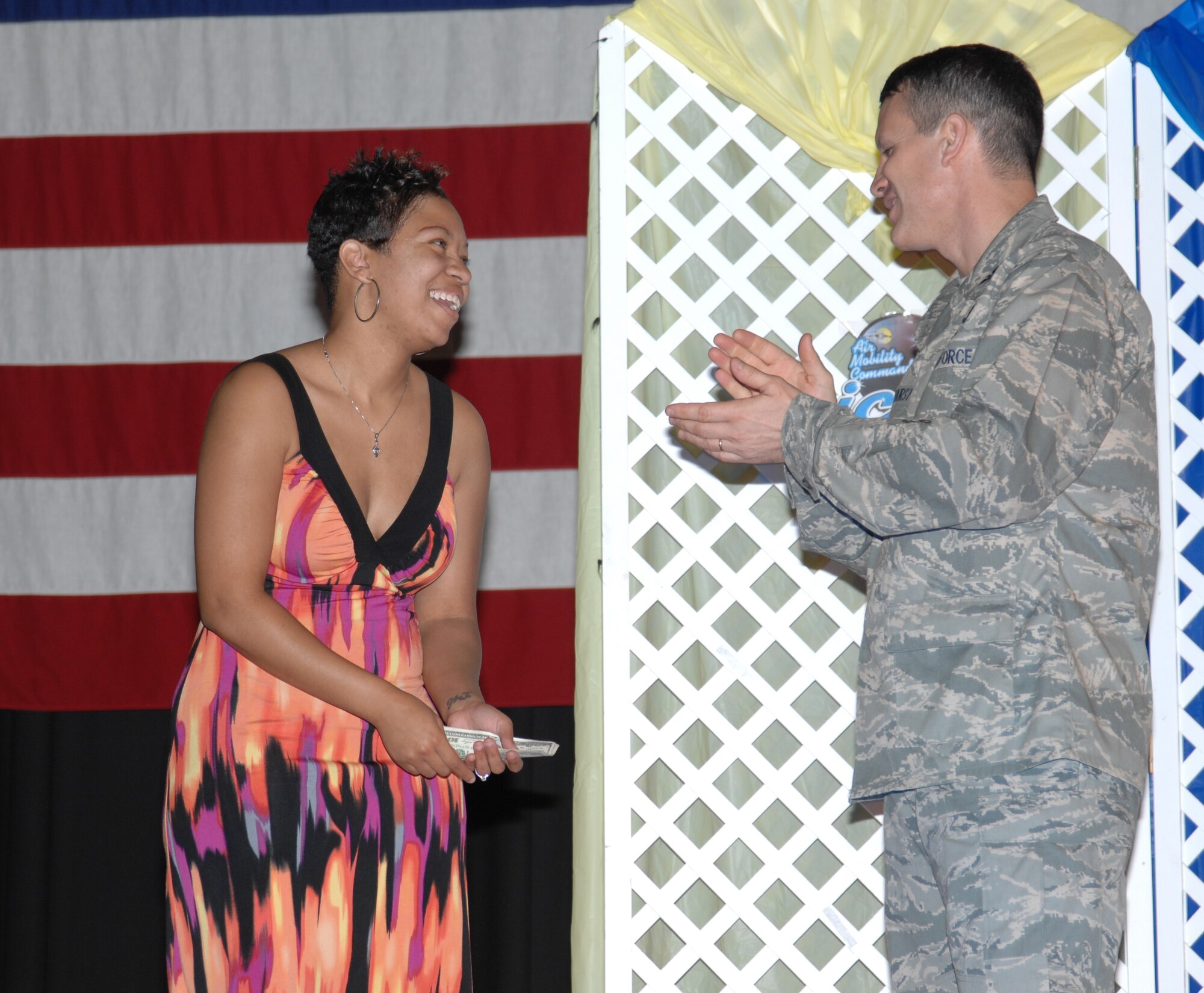 Col. Jamie Crowhurst, 22nd Air Refueling Wing commander, congratulates Staff Sgt. Brenda Johnson, 22nd Force Support Squadron Military Personnel Section Career Development assistant NCOIC, and winner of the 2010 McConnell Icon Aug. 13, 2010. McConnell Idol is part of a larger program called Air Mobility Command Idol. Sergeant Johnson is scheduled to represent McConnell at the command competition Oct. 25, 2010. (U.S. Air Force photo/Airman 1st Class Armando A. Schwier-Morales)