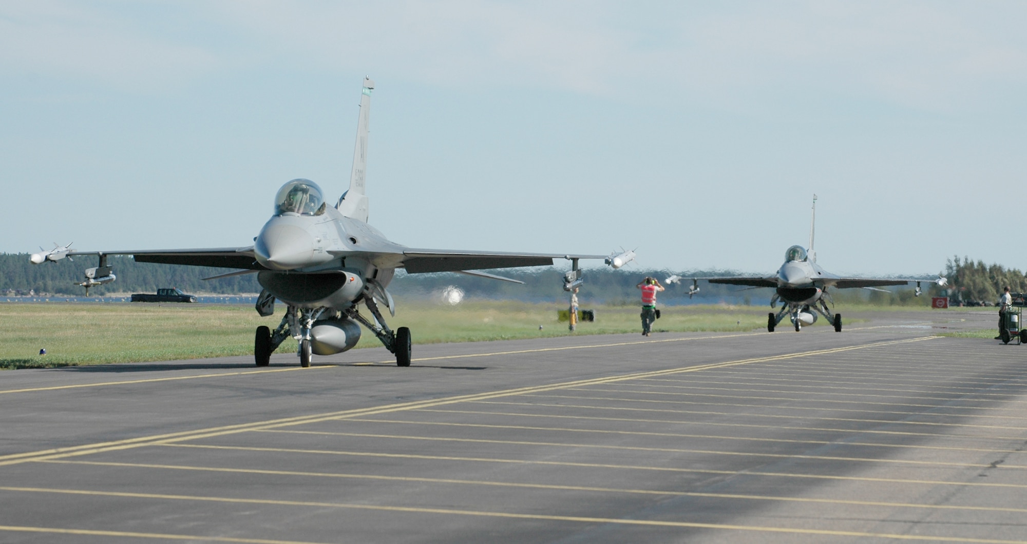 Two Aviano F-16 Fighting Falcons taxi down the runway after conducting an air-to-ground flying mission Aug. 5, 2010, at Kallax Air Base, Sweden. More than 250 Airmen from the 555th Fighter Squadron and 31st Aircraft Maintenance Squadron traveled to the Swedish air base on July 30, 2010 for a two week exercise conducting air-to-air and air-to-ground flying missions alongside Swedish air force members assigned to Norrbotten Wing. (U.S. Air Force photo/Tech. Sgt. Lindsey Maurice) 