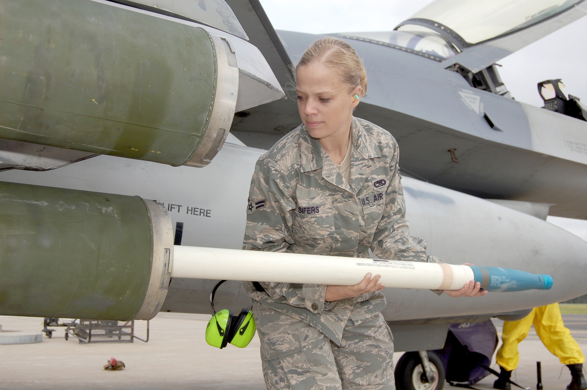 Airman 1st Class Kelly Sifers loads a practice rocket onto an F-16 Fighting Falcon during a training exercise Aug. 4, 2010, at Kallax Air Base, Sweden. The 555th Fighter Squadron and 31st Aircraft Maintenance Squadron conducted more than 180 air-to-air and air-to-ground missions during a two-week exercise here working alongside members of the Swedish air force's Norrbotten Wing. Airman Sifers is a 31st Aircraft Maintenance Squadron weapons load crew member. (U.S. Air Force photo/Tech. Sgt. Lindsey Maurice)

