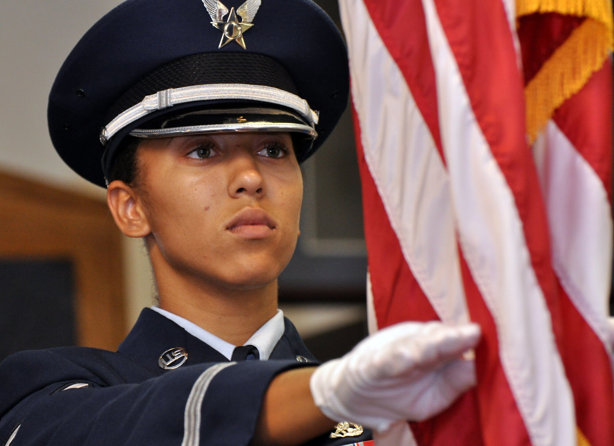 BARKSDALE AIR FORCE BASE, La. - Senior Airman Ciarra Shady practices the posting of the Colors during a dress rehearsal.  Airman Shady is the 2009 Chief Master Sergeant of the Air Force base honor guard member of the year.  (U.S. Air Force photo/Master Sgt. Corey A. Clements)