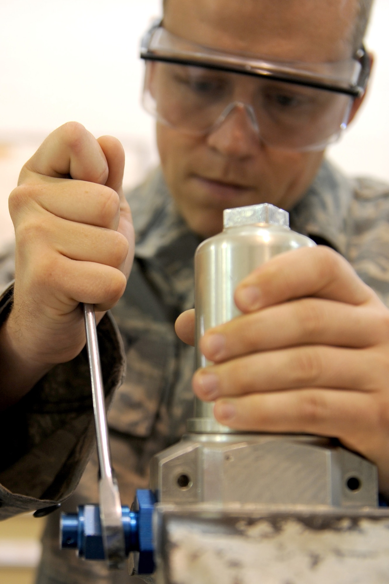 Staff Sgt. Michael Mahaney, 906th Air Refueling Squadron, overhauls a hydraulic filter assembly for a KC-135 Stratotanker at Scott AFB, July 20, 2010. Replacing the dirty filters ensures clean hydraulic fluid runs through the system on the KC-135. Sergeant Mahaney is an active duty member working alongside the Air National Guard of the 126th Air Refueling Wing as part of joint effort between active and guard units to keep the KC-135?s flying. (U.S. Air Force photo by Staff Sgt. Brian J. Ellis)