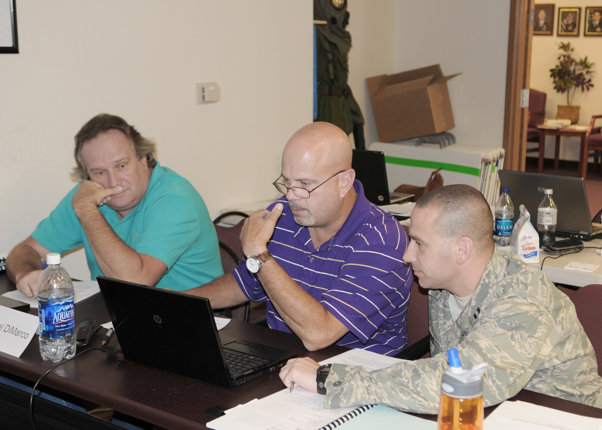 Students attending the Integrated Defense Risk Management Process and ForcePRO workshop July 30, 2010, at Moody Air Force Base, Ga., work together in teams to accomplish classroom exercises. The training is designed to teach students risk management principles through a new software program. (U.S. Air Force photo/Tech. Sgt. Patrick Hyde)