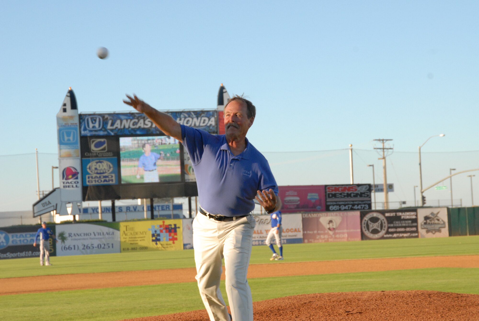 Former NASA astronaut Robert "Hoot" Gibson threw out the ceremonial first pitch during the Lancaster JetHawks' game Aug. 14.  He was honored by the Lancaster JetHawks baseball team during its annual Aerospace Appreciation Night. (Air Force photo by Meredith Mingledorff)