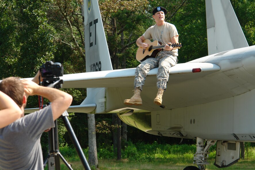 The F-15 Eagle static display aircraft at Arnold Air Force Base, Tenn., was used as part of a music video shoot for Country musician Marty Falle Aug. 14. The video for the song "Fly me Back" will benefit the Wounded Warrior Project, which serves severely wounded service members. (AF photo by Darbie Sizemore)