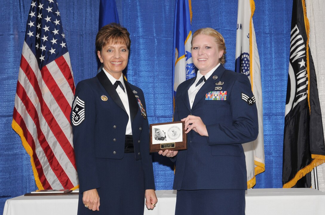 McGHEE TYSON AIR NATIONAL GUARD BASE, Tenn. - Senior Airman Anna C. Blair, right, receives the distinguished graduate award for Airman Leadership School Class 10-5 at The I.G. Brown Air National Guard Training and Education Center here from Chief Master Sgt. Denise Jelinski-Hall, Aug. 12, 2010.  The distinguished graduate award is presented to students in the top ten percent of the class.  It is based on objective and performance evaluations, demonstrated leadership, and performance as a team player. (U.S. Air Force photo by Master Sgt. Kurt Skoglund/Released)