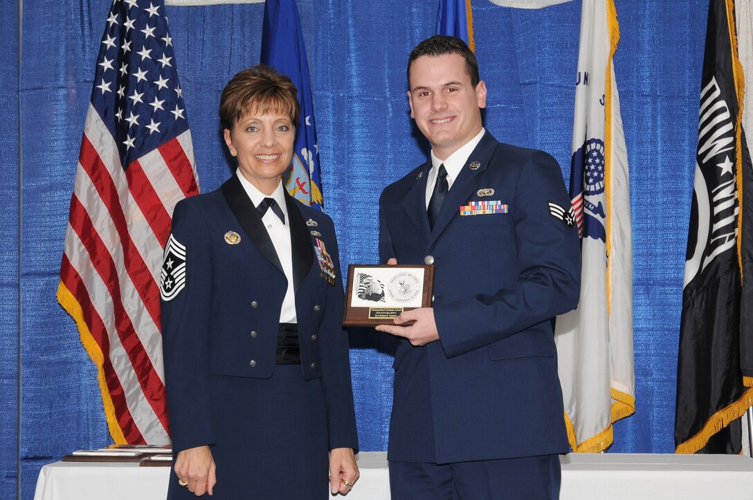 McGHEE TYSON AIR NATIONAL GUARD BASE, Tenn. - Senior Airman Robert E. Hepner, right, receives the distinguished graduate award for Airman Leadership School Class 10-5 at The I.G. Brown Air National Guard Training and Education Center here from Chief Master Sgt. Denise Jelinski-Hall, Aug. 12, 2010.  The distinguished graduate award is presented to students in the top ten percent of the class.  It is based on objective and performance evaluations, demonstrated leadership, and performance as a team player. (U.S. Air Force photo by Master Sgt. Kurt Skoglund/Released)