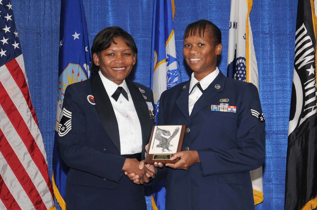 McGHEE TYSON AIR NATIONAL GUARD BASE, Tenn. - Senior Airman Deanndra L. Torres, right, receives the Paul H. Lankford leadership award for Airman Leadership School Class 10-5 at The I.G. Brown Air National Guard Training and Education Center here from Chief Master Sgt. Deborah F. Davidson, EPME commandant, Aug. 12, 2010. The leadership award is presented to the student who made the most significant contribution to the overall success of the class by demonstrating superior leadership abilities and excellent skills as a team member.  It is named in honor of CMSgt Paul H. Lankford, a Bataan Death March survivor and the first commandant of the Air National Guard Enlisted Professional Military Education Center.  (U.S. Air Force photo by Master Sgt. Kurt Skoglund/Released)