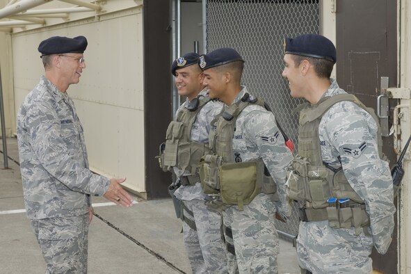Col. Robert Mendenhall, 341st Security Forces Group commander, visits with Staff Sgt. Esequiel Munguia, and Airmen 1st Class Alan Crawford, and Aaron Simpson during a walk through with the Tactical Response Force.