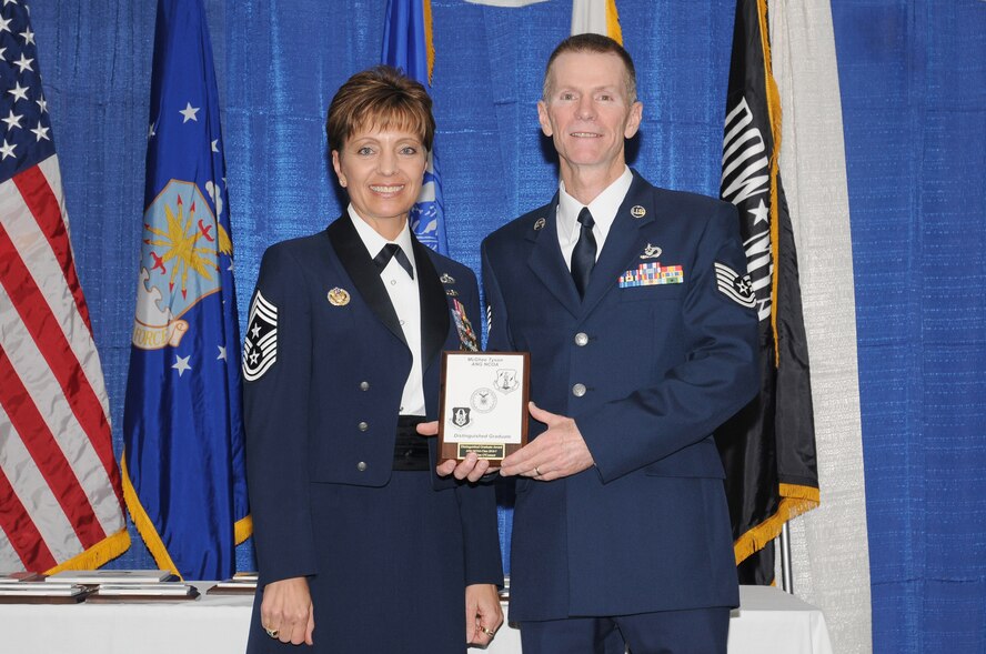 McGHEE TYSON AIR NATIONAL GUARD BASE, Tenn. -- Tech. Sgt. Brian O'Connor, right, receives the distinguished graduate award for NCO Academy Class 10-7 at The I.G. Brown Air National Guard Training and Education Center here from Chief Master Sgt. Denise Jelinski-Hall, Aug. 12, 2010.  The distinguished graduate award is presented to students in the top ten percent of the class.  It is based on objective and performance evaluations, demonstrated leadership, and performance as a team player. (U.S. Air Force photo by Master Sgt. Kurt Skoglund/Released)