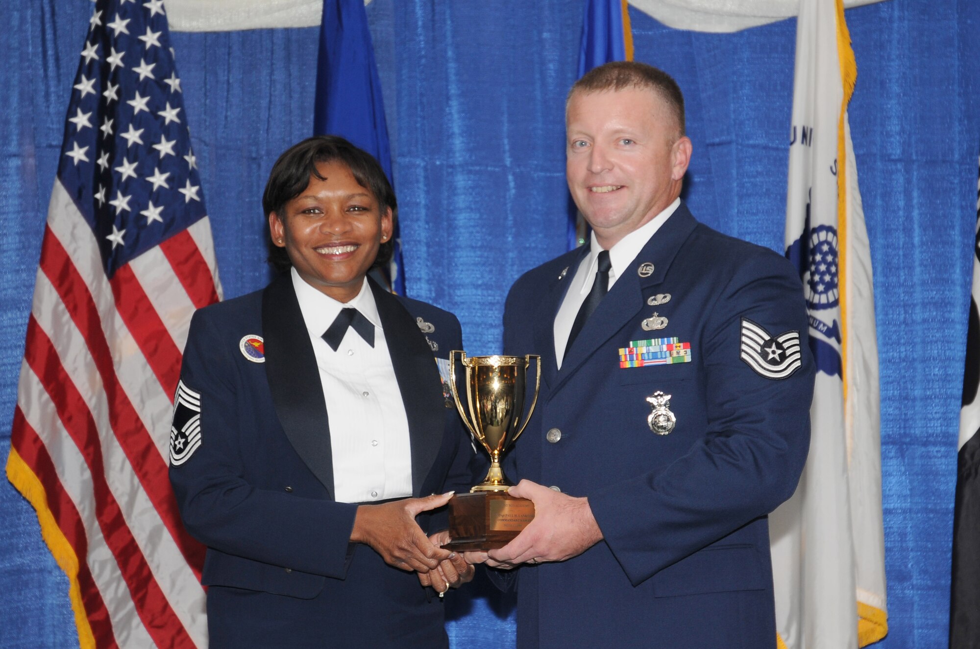 McGHEE TYSON AIR NATIONAL GUARD BASE, Tenn. -- Tech. Sgt. Michael W. Parson, right, receives the Paul H. Lankford leadership award for NCO Academy Class 10-7 at The I.G. Brown Air National Guard Training and Education Center here from Chief Master Sgt. Deborah F. Davidson, EPME commandant, Aug. 12, 2010. The leadership award is presented to the student who made the most significant contribution to the overall success of the class by demonstrating superior leadership abilities and excellent skills as a team member.  It is named in honor of CMSgt Paul H. Lankford, a Bataan Death March survivor and the first commandant of the Air National Guard Enlisted Professional Military Education Center.  (U.S. Air Force photo by Master Sgt. Kurt Skoglund/Released)