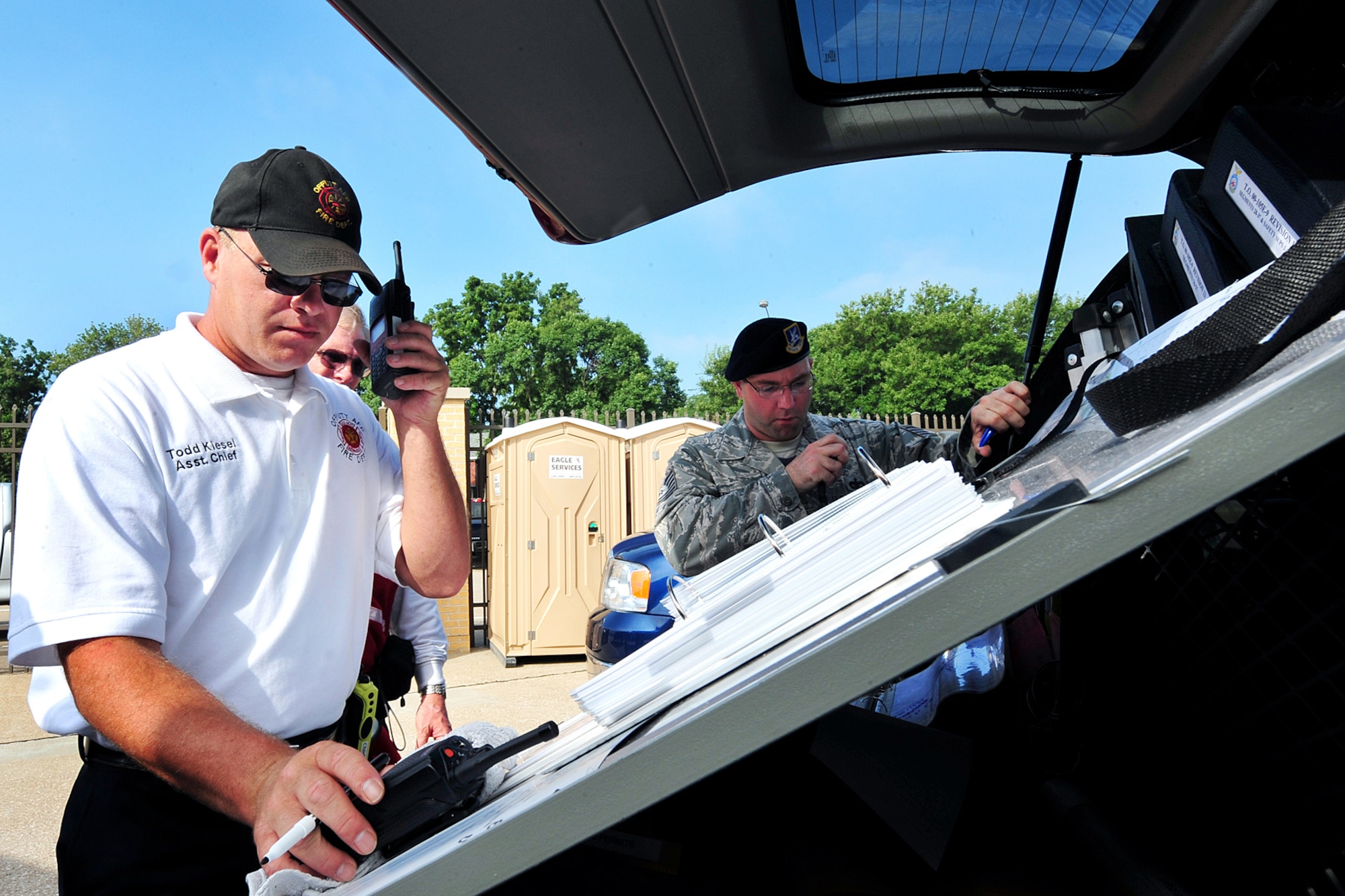 OFFUTT AIR FORCE BASE, Neb. - Todd Kiesel, 55th Civil Engineer Squadron assistant fire chief and incident commander, receives information from medical personnel about the number of casualties during a major accident response exercise August 14. Airmen with the 55th Medical Group worked with medical professionals from the surrounding Omaha metro area in this annual exercise that simulates an aircraft accidnet during an air show to prepare for the Defenders of Freedom Open House and Air Show hosted here. U.S. Air Force photo by Charles Haymond