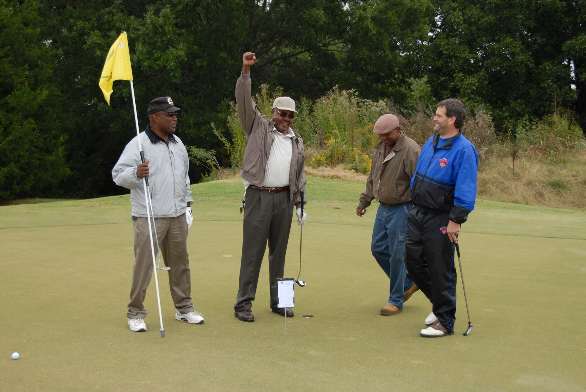 Participants celebrate at last years golf tournament.