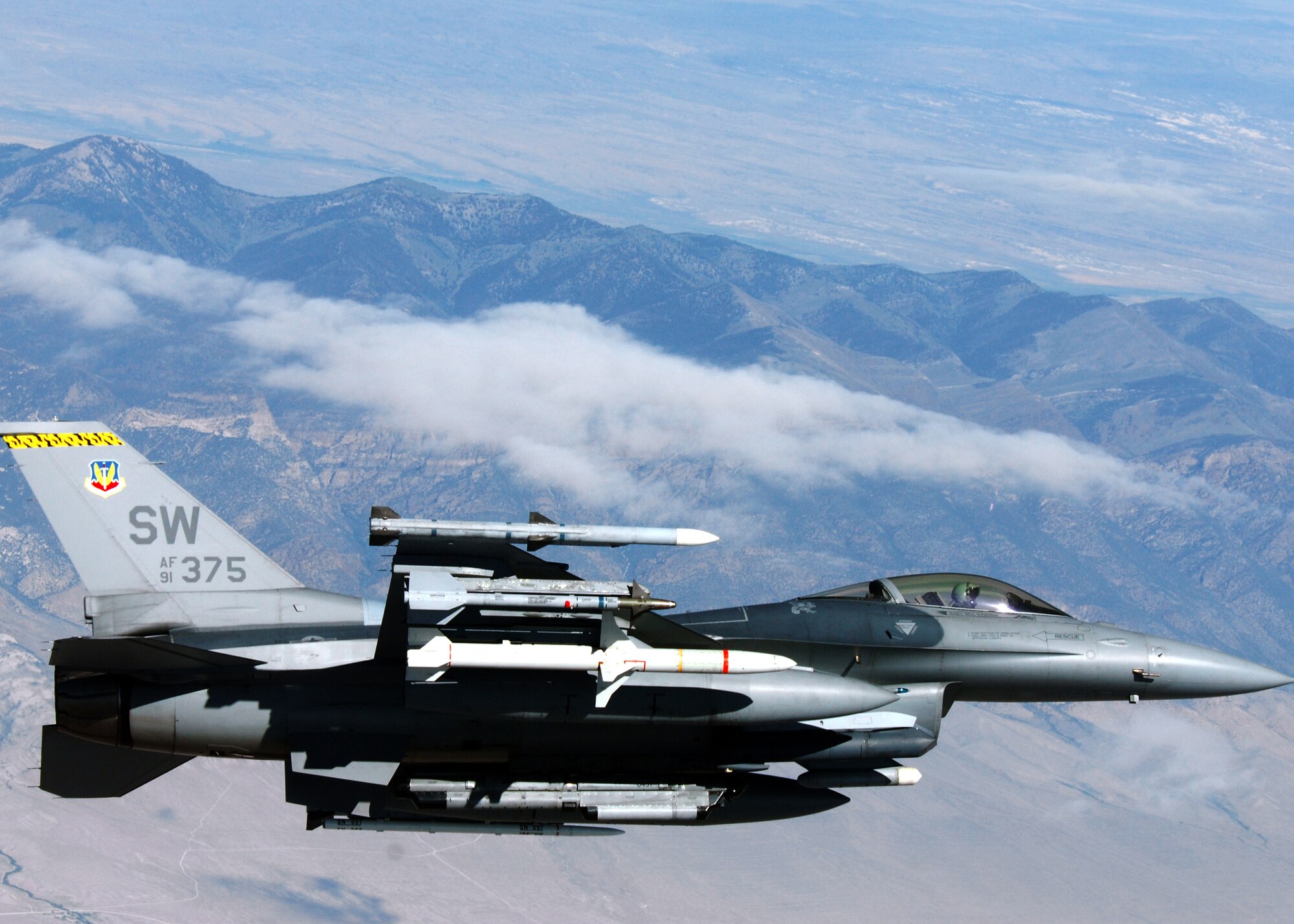 An F-16 Fighting Falcon from the 79th Fighter Squadron at Shaw Air Force Base, S.C., flies loaded with bombs during a Weapons System Evaluation Program mission at Hill Air Force Base, Utah. This is the second of three weeks of evaluation at Hill AFB by the 53rd Weapons Evaluation Group.  The WSEP program is used to evaluate the effectiveness and suitability of combat air force weapon systems. The evaluations are accomplished during tactical deliveries of fighter, bomber and unmanned aerial system precision guided munitions, on realistic targets with air-to-air and surface-to-air defenses. For many of the aircrew participating in WSEP, it is the first time employing live weapons. This provides a level of combat experience many units face during combat.  Courtesy photo.