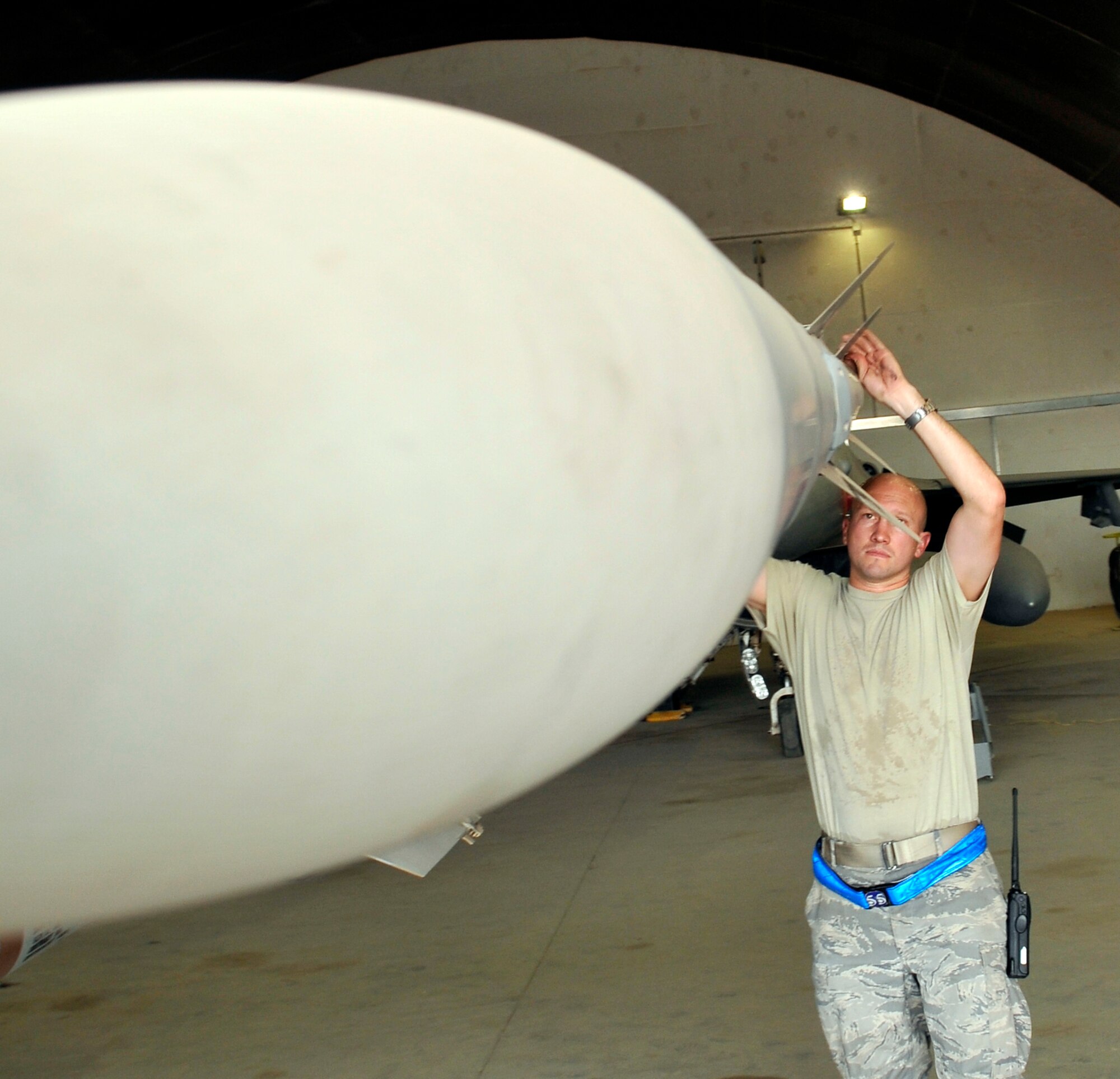 Master Sgt. Jesse Mathes, 332nd Expeditionary Aircraft Maintenance Squadron Viper Aircraft Maintenance Unit production superintendant, checks the guide fins are properly secured on an AIM-120 advanced medium-range air-to-air missile on an F-16 Fighting Falcon during an exceptional release inspection Aug. 6, 2010, Joint Base Balad, Iraq. The AMRAAM missile improves the aerial combat capabilities of U.S. and allied aircraft to meet current and future threat of enemy air-to-air weapons. Sergeant Mathes, a native of Gate City, Va., is deployed from Shaw Air Force Base, S.C. (U.S. Air Force photo/staff Sgt. Phillip Butterfield)