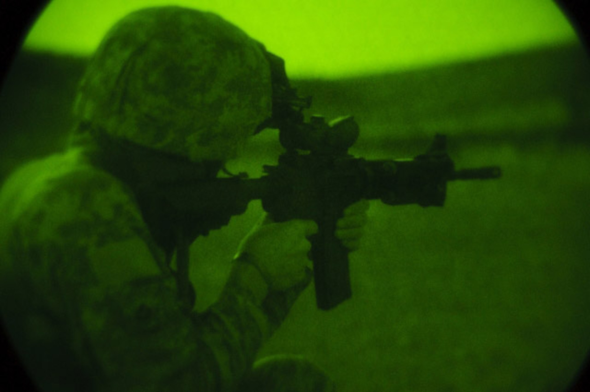 U.S. Army Pfc. Joshua Murphy, Provincial Reconstruction Team Zabul rifleman, fires his rifle using night vision optics at Combat Outpost Mizan, Zabul Province, Aug. 11. Airmen and soldiers from the PRT regularly check their sights for accuracy.  (U.S. Air Force photo by Senior Airman Nathanael Callon/released)  