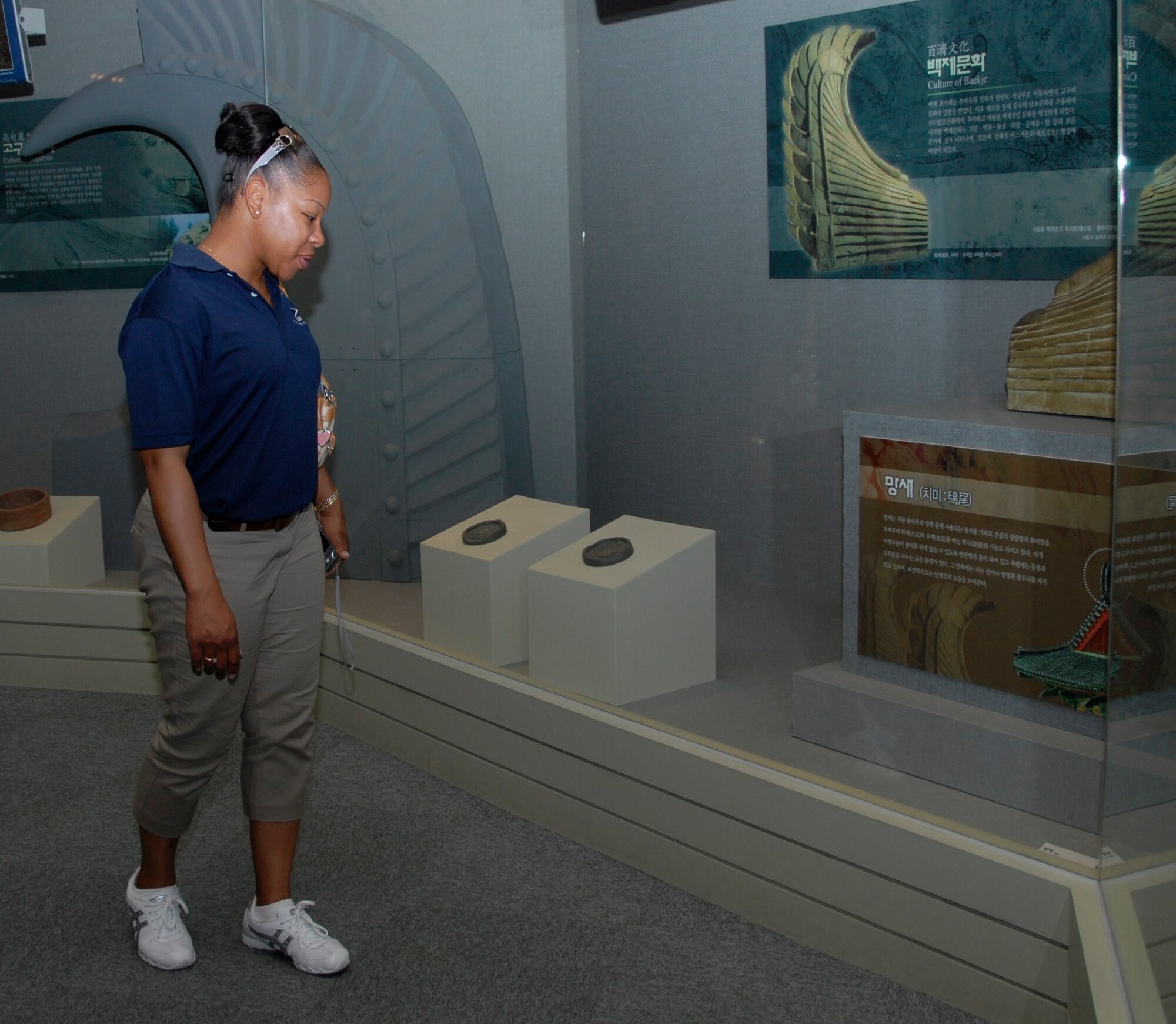 KUNSAN AIR BASE, Republic of Korea -- Senior Master Sgt. Yasmeen Wilson, 8th Maintenance Squadron first sergeant, looks at Baekje relics at the Baekje Historical Museum in Buyeo, Korea, during an 8th Fighter Wing and 38th Fighter Group senior NCO culture tour Aug. 10. The tour gave the Wolf Pack and Republic of Korea Air Force members the opportunity to experience Korean culture while building the U.S. and ROKAF alliance. (U.S. Air Force photo/Staff Sgt. Amanda Savannah) 