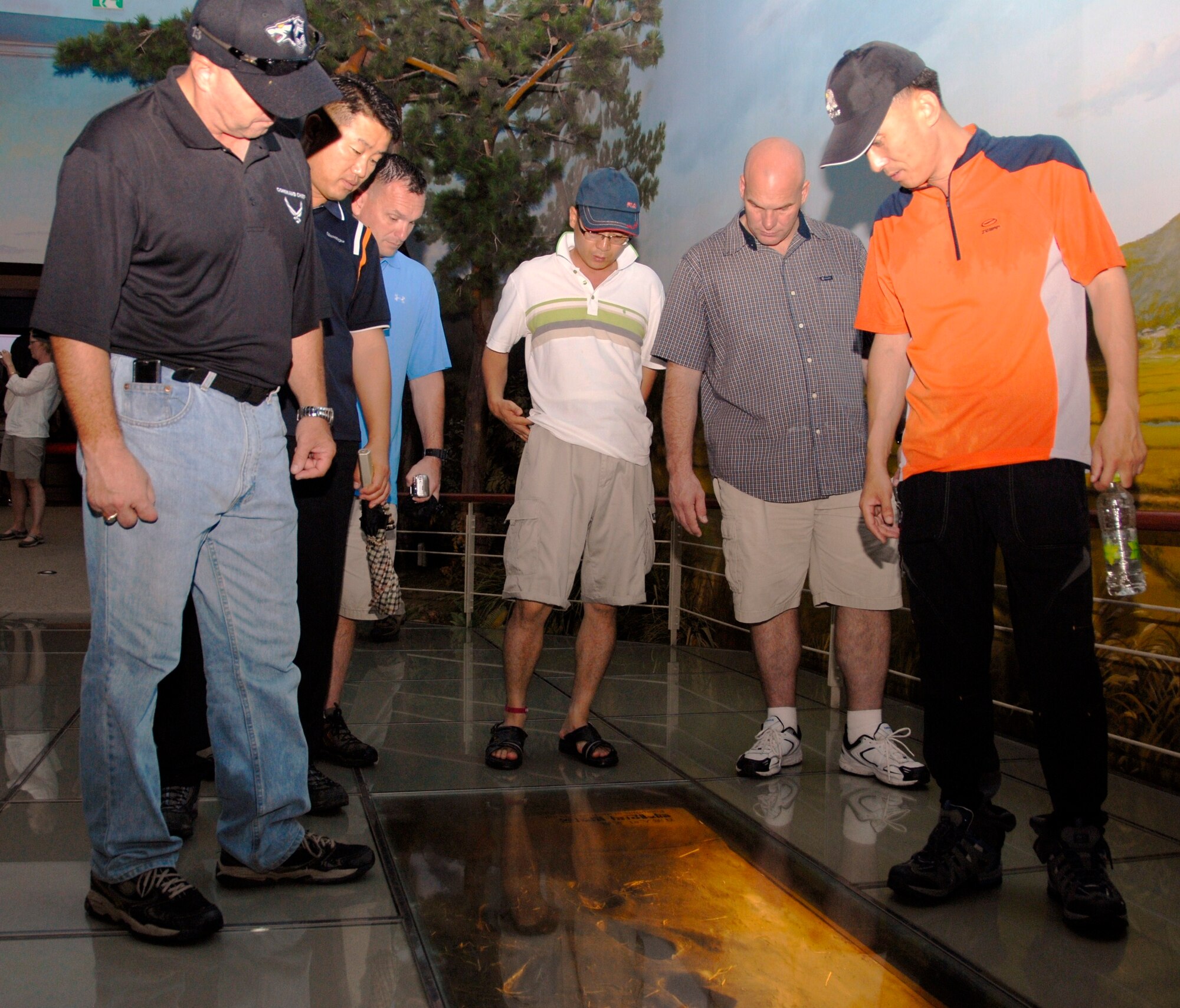 KUNSAN AIR BASE, Republic of Korea -- Eighth Fighter Wing and 38th Fighter Group senior NCOs look at footprint relics of Baekje people at the Baekje Historical Museum in Buyeo, Korea, during an 8th FW and 38th FG senior NCO culture tour Aug. 10. The tour gave the Wolf Pack and Republic of Korea Air Force members the opportunity to experience Korean culture while building the U.S. and ROKAF alliance. (U.S. Air Force photo/Staff Sgt. Amanda Savannah) 