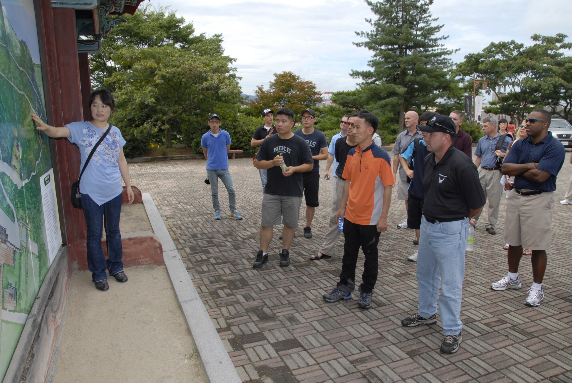 KUNSAN AIR BASE, Republic of Korea -- Choi Jung-Hyun, tour guide, talks about points along a trail up Mount Busosan in Buyeo, Korea, during an 8th Fighter Wing and 38th Fighter Group senior NCO culture tour Aug. 10. Mount Busosan is the site of Buso Mountain Fortress, the Baekje Dynasty’s fortress, which fell in 660. The tour gave the Wolf Pack and Republic of Korea Air Force members the opportunity to experience Korean culture while building the U.S. and ROKAF alliance. (U.S. Air Force photo/Staff Sgt. Amanda Savannah) 