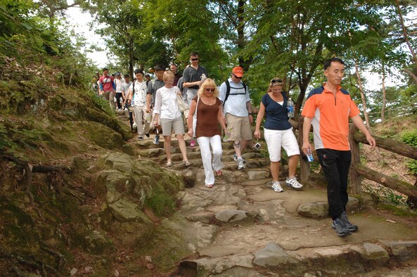 KUNSAN AIR BASE, Republic of Korea -- Chief Master Sgt. Choi Sang-Gi, 38th Fighter Group chief, leads a group of 20 8th Fighter Wing and 20 38th FG senior NCOs down Mount Busosan, Korea, during a culture tour Aug. 10. The tour gave the Wolf Pack and Republic of Korea Air Force members the opportunity to experience Korean culture while building the U.S. and ROKAF alliance. (Republic of Korea Air Force photo/Staff Sgt. Lee Jae-Sung) 