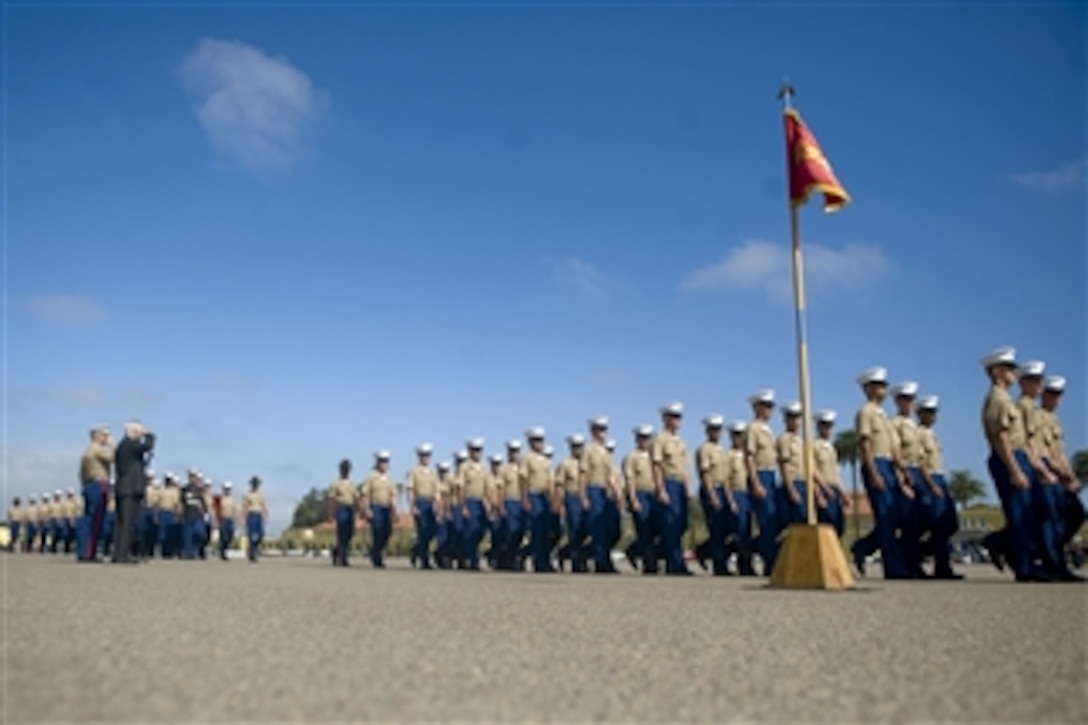 Secretary of Defense Robert M. Gates salutes as newly enlisted Marines conduct a pass in review during their graduation ceremony at the Marine Corps Recruit Depot in San Diego, Calif., on Aug. 13, 2010.  