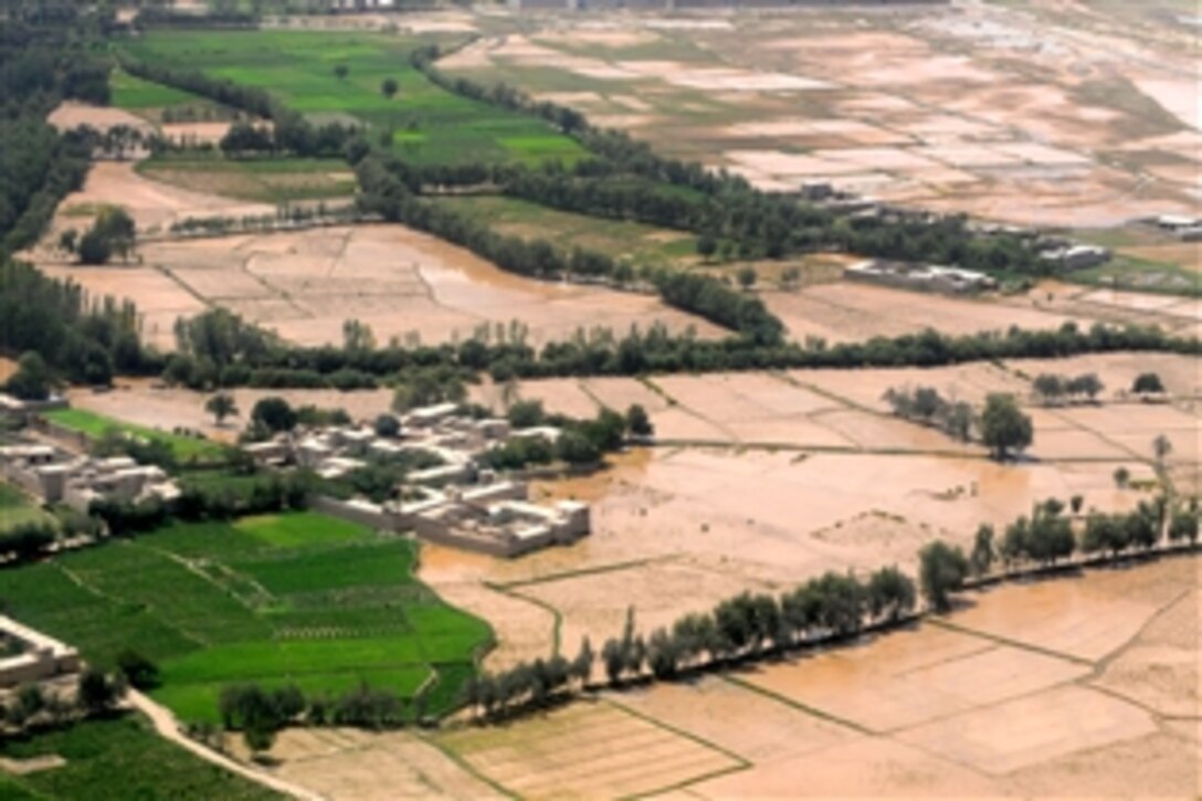 An aerial view of flooding across the Musahi municipality of Kabul, Afghanistan, Aug. 15, 2010. Heavy rains in the area collapsed a retaining wall along a local river causing the deluge, destroying crops, and displacing many from their homes.