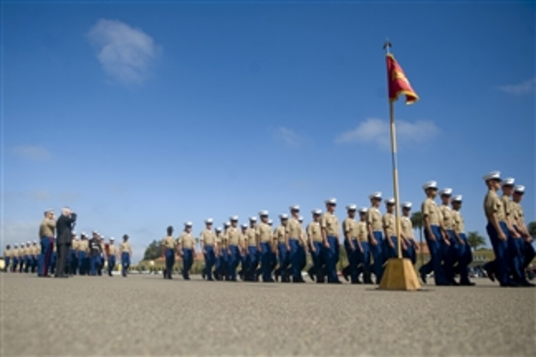 Secretary of Defense Robert M. Gates salutes as newly enlisted Marines conduct a pass in review during their graduation ceremony at the Marine Corps Recruit Depot in San Diego, Calif., on Aug. 13, 2010.  