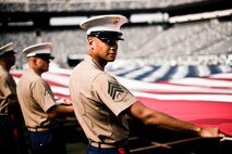 Marines, Sailors, Coast Guardsmen, Airmen and Soldiers practiced unfurling an American Flag across the field for a pre-game ceremony before the New York Jets vs New York Giants game, Aug. 16, East Rutherford, N.J. The game was the first football game in New Meadowlands Stadium, the newly built home of both New York football teams. (Official Marine Corps photo by Sgt. Randall A. Clinton / RELEASED)