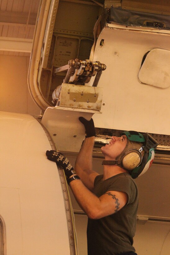 Lance Cpl. Brian S. Meaker, fixed-wing airframe mechanic with Marine Transport Squadron 1, inspects the cargo entrance on a C-9 at VMR-1’s hangar Aug. 17. Cherry Point named Meaker the station’s third Service Person of the Quarter for 2010 at the Elks Lodge in Morehead City, N.C., Aug. 13.