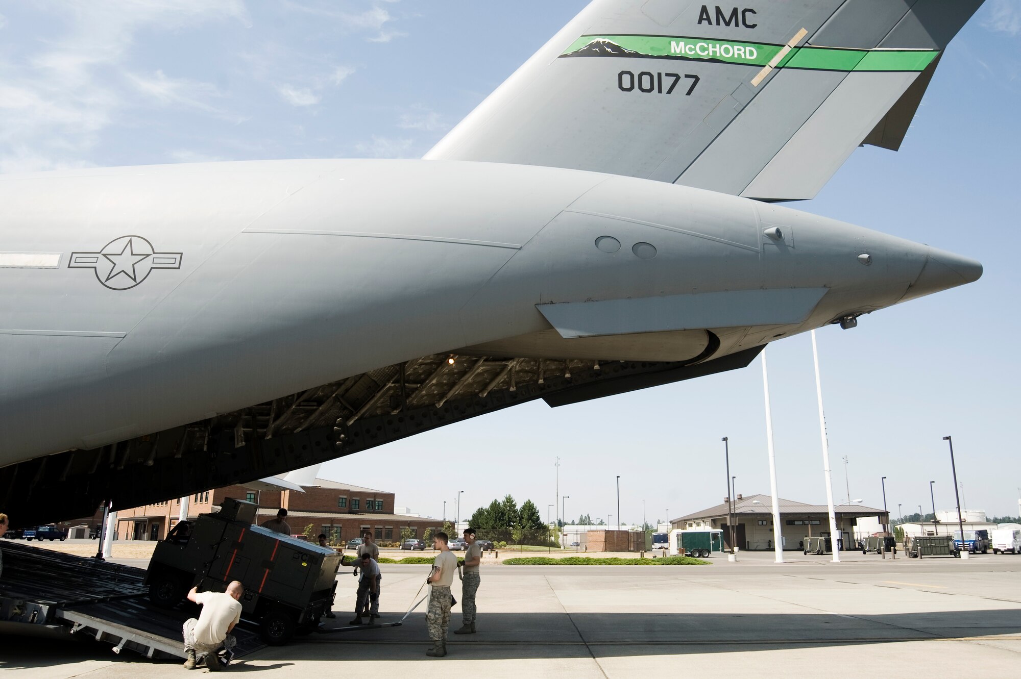 U.S. Air Force Airmen load cargo onboard a C-17 Globemaster III during Aerial Port Expeditor training Aug. 17 at Joint Base Lewis-McChord, Wash. (U.S. Air Force photo/Abner Guzman)
