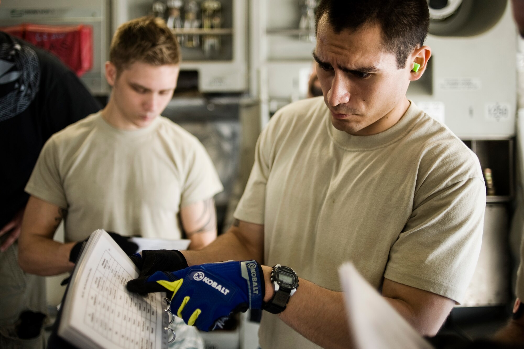 Staff Sgt. Marcelino Figueroa, 732nd Air Mobility Squadron, Elmendorf Air Force Base, Alaska, reviews a loading chart onboard a C-17 Globemaster III during Aerial Port Expeditor training Aug. 17 at Joint Base-Lewis McChord, Wash. (U.S. Air Force photo/Abner Guzman)

