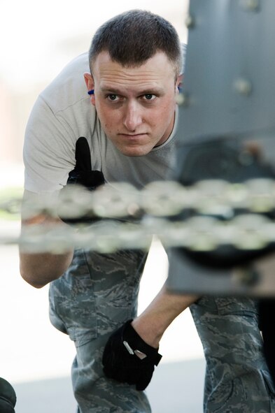 Senior Airman Adam Mertz gives the "thumbs up" while loading cargo Aug. 17, 2010, at Joint Base Lewis-McChord, Wash. Airman Mertz, undergoing aerial port expeditor training, is assigned to the 721st Aerial Port Squadron, Ramstein Air Base, Germany. (U.S. Air Force Photo/Abner Guzman)