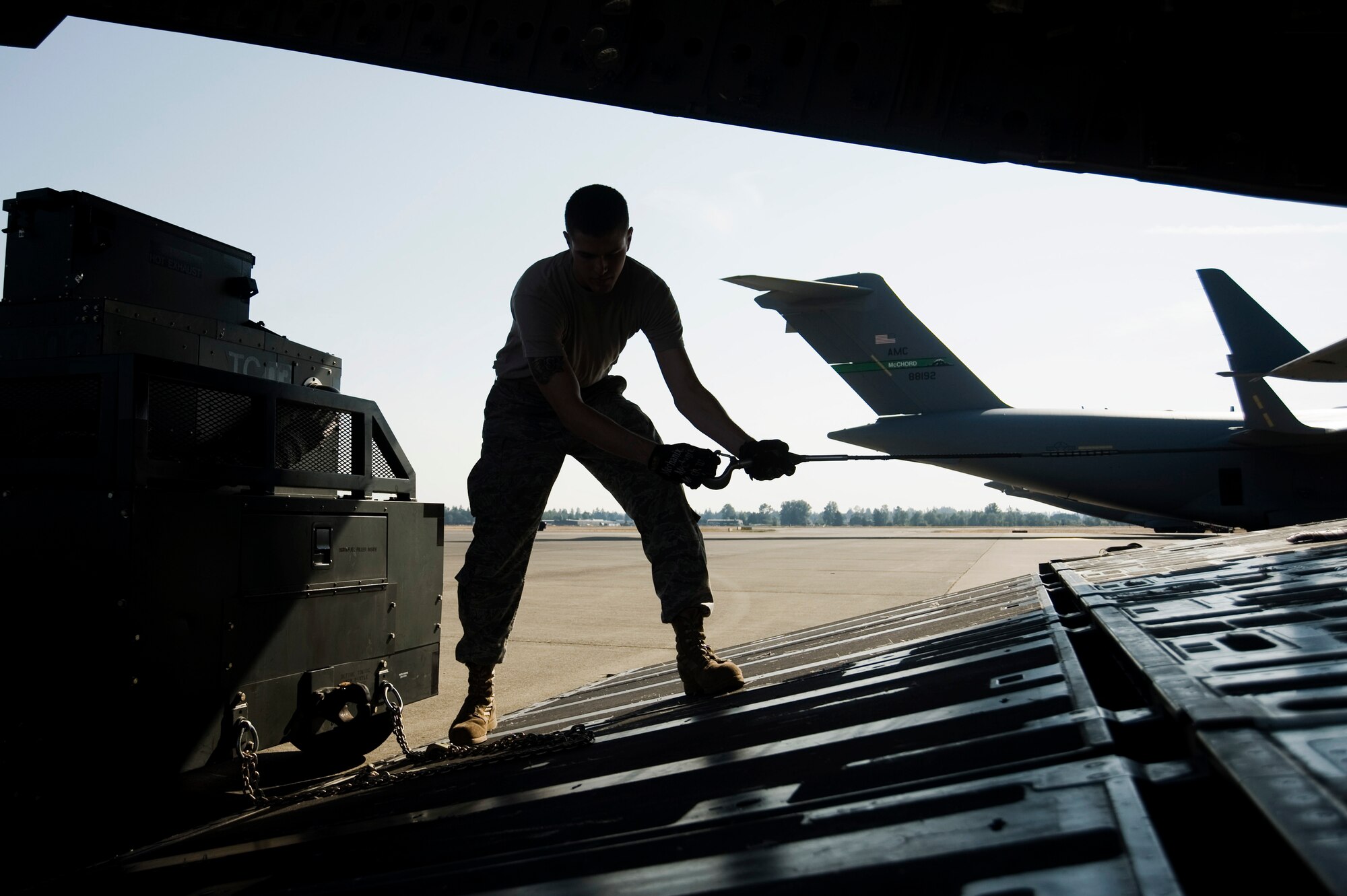 Senior Airman Jeremy Schmid, 62nd Aerial Port Squadron, loads cargo while undergoing Aerial Port Expeditor training Aug. 17 at Joint Base Lewis-McChord, Wash. (U.S. Air Force photo/Abner Guzman)


