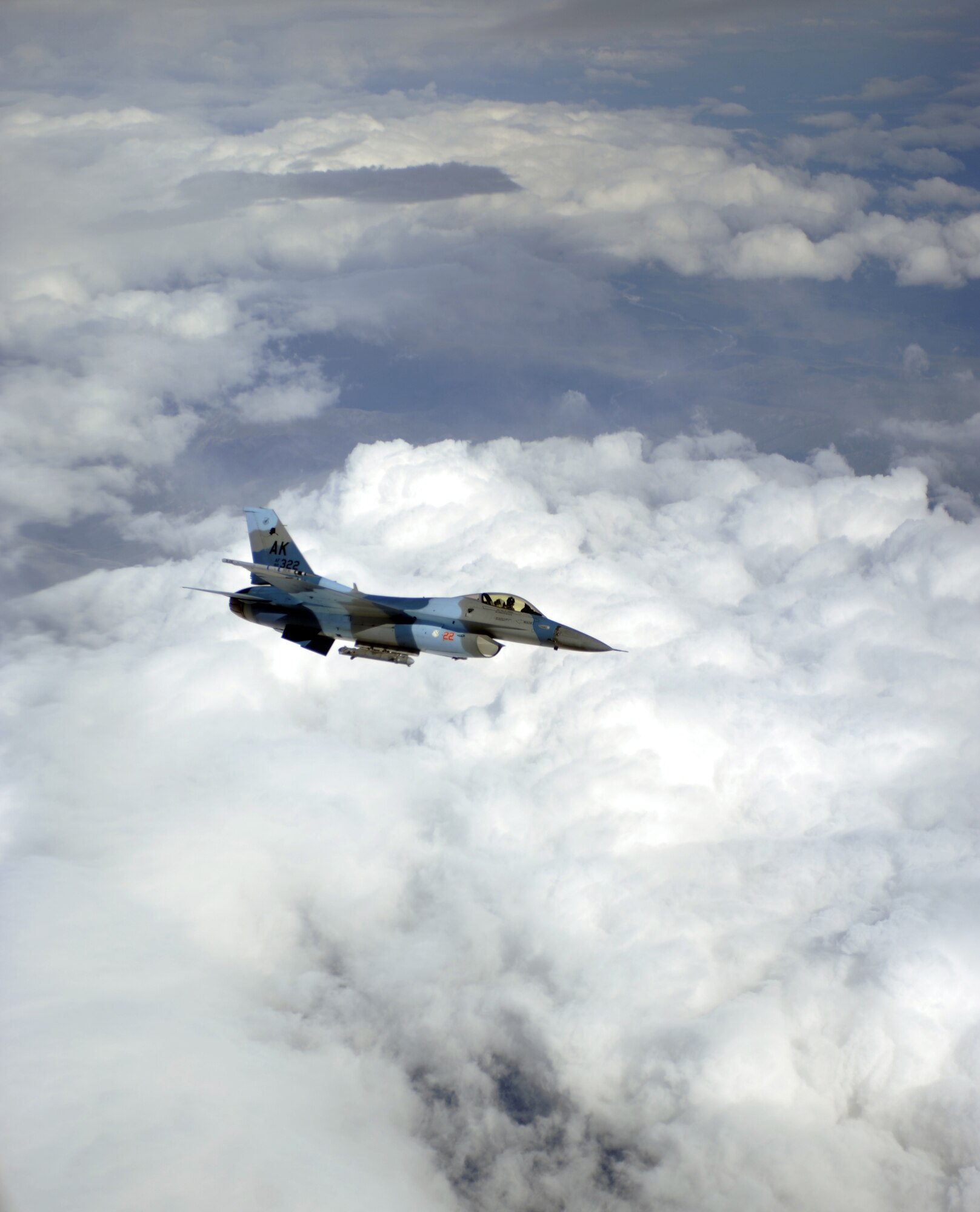 An F-16 Fighting Falcons holds his position after refueling August 10, 2010, Eielson Air Force Base, Alaska. The F-16s are assigned to the 354th Fighter Wing, 18th Aggressor Squadron and are the host unit of Red Flag-Alaska. RF-A is a semi-annual training event involving multiple units that allows multi-platform aviation and ground unit to collaborate improving interoperability. (U.S. Air Force photo/Senior Airman Willard E. Grande II)