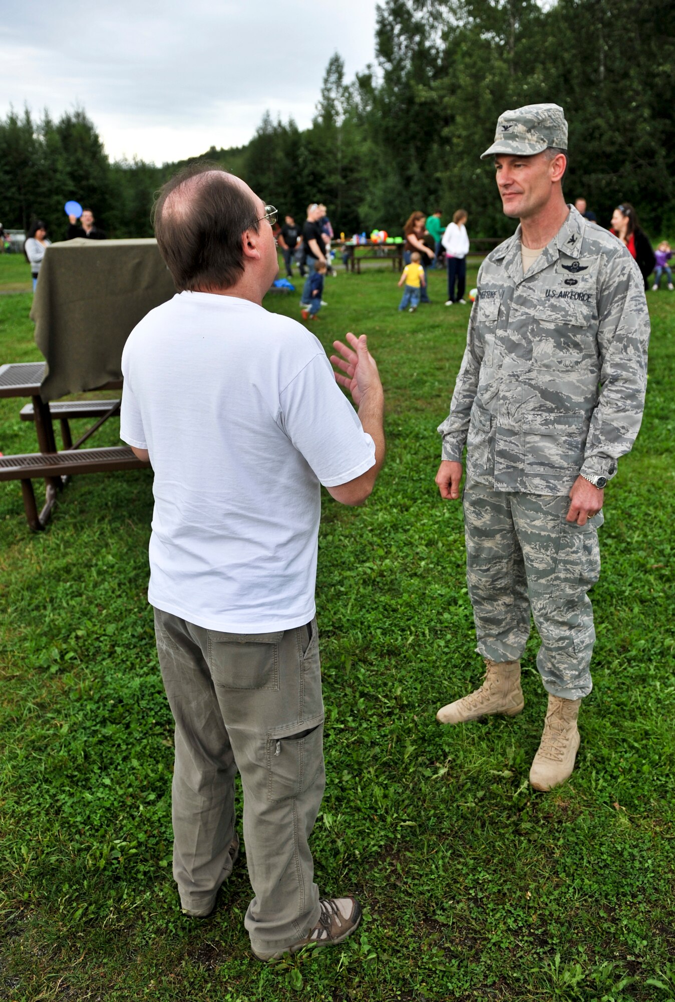 JOINT BASE ELMENDORF-RICHARDSON, Alaska – Col. Eric Overturf, 477th Fighter Group commander, receives a brief of what will happen during the American Bald Eagle release, Aug. 15, from Dave Dorsey, Bird Treatment and Learning Center, Anchorage. (Photo by Airman 1st Class Christopher Gross/JBER PAO)