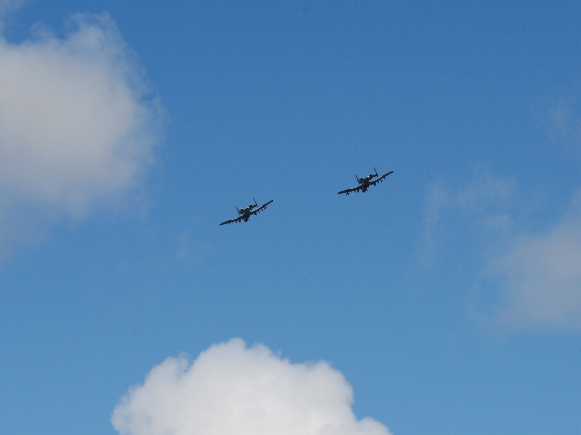 Two A-10 Thunderbolts II fly as wingmen over the Joint Pacific Alaskan Range Complex during Red Flag Alaska 10-4 August 12, Eielson Air Force Base, Alaska. The JPARC provides 67,000 square miles of airspace, more than 30 threat simulators, one conventional bombing range, and two tactical bombing ranges containing more than 400 different types of targets. (U.S. Air Force photo/Airman 1st Class Laura Goodgame)
