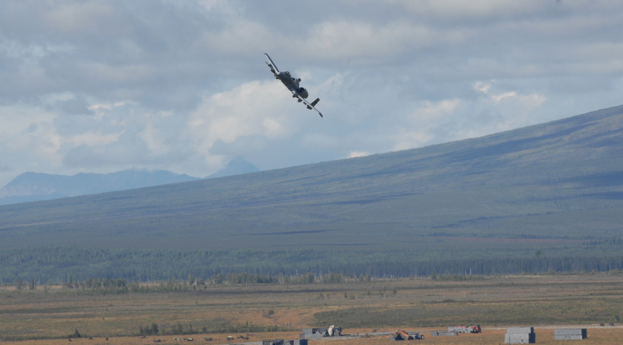 An A-10 Thunderbolts II fly over the Joint Pacific Alaskan Range Complex during Red Flag Alaska 10-4 August 12, 2010, Eielson Air Force Base, Alaska. The JPARC provides 67,000 square miles of airspace, more than 30 threat simulators, one conventional bombing range, and two tactical bombing ranges containing more than 400 different types of targets. (U.S. Air Force photo/Airman 1st Class Laura Goodgame)