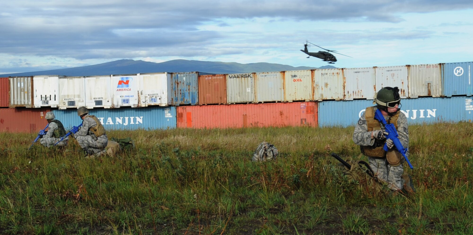 Airmen simulate pulling 360 degrees of security down range after being dropped off by a UH-60 Black Hawk during Red-Flag Alaska 10-4, August 12, 2010, Eielson Air Force Base, Alaska. The joint terminal air controllers identify ground targets for close air support missions downrange. RF-A provides oppertunities to integrate joint, coalition and bilateral training from simulated forward operating bases that the 67,000 square mile Joint Pacific Alaska Range Complex has to offer. The JTACs are assigned to Wheeler Army Air Field, Hawaii. (U.S. Air Force photo/Airman 1st Class Laura Goodgame)