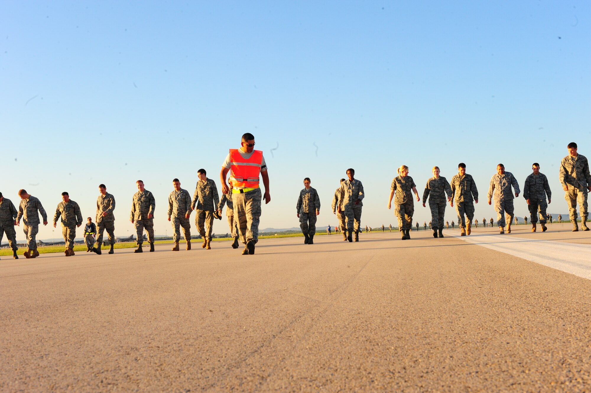 Airmen from the 7th Bomb Wing complete a foreign object debris sweep on the flightline here Aug. 6. Dyess celebrated one year without FOD causing an incident resulting in damage costing $50,000 or more Aug. 13. This is currently the wing record since March 2008 when the wing went 209 days without an incident. In fiscal year 2009, the wing had $963,615 dollars in chargeable incidents. (U.S. Air Force photo/Airman 1st Class Chelsea Cummings)