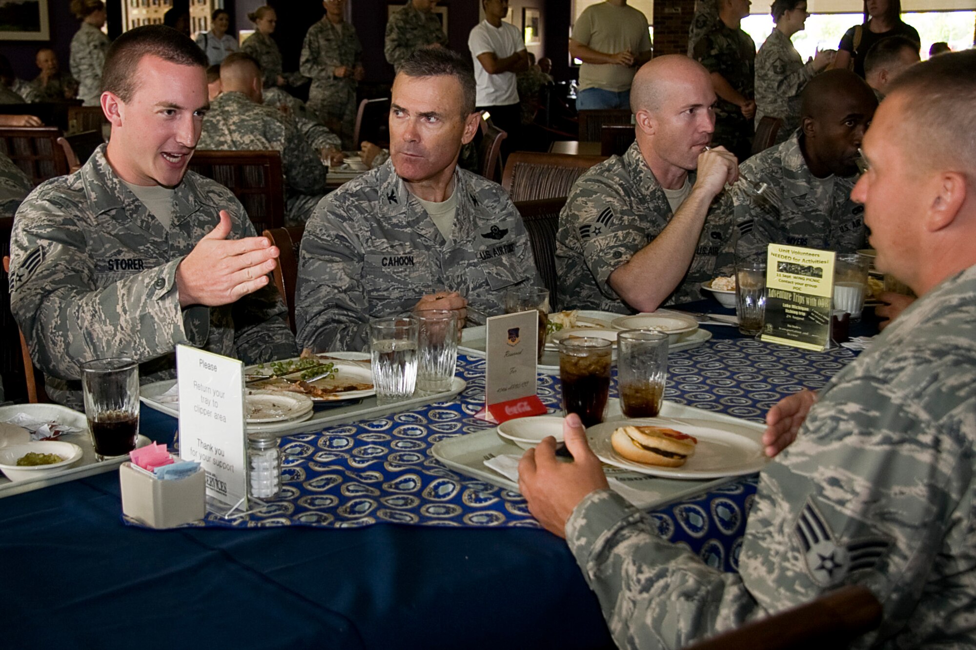 GRISSOM AIR RESERVE BASE, Ind. -- Senior Airman Nathaniel Storer, an aircraft electronics and environmental systems specialist with the 434th Maintenance Squadron, talks with other Grissom maintainers and Col. William T. "Tim" Cahoon at a luncheon held during the August unit training assembly. Colonel Cahoon, who is the 434th Air Refueling Wing commander, will host a luncheon with Airmen at the 434th Services Complex every UTA from different squadrons. (U.S. Air Force photo/Tech. Sgt. Mark R. W. Orders-Woempner)