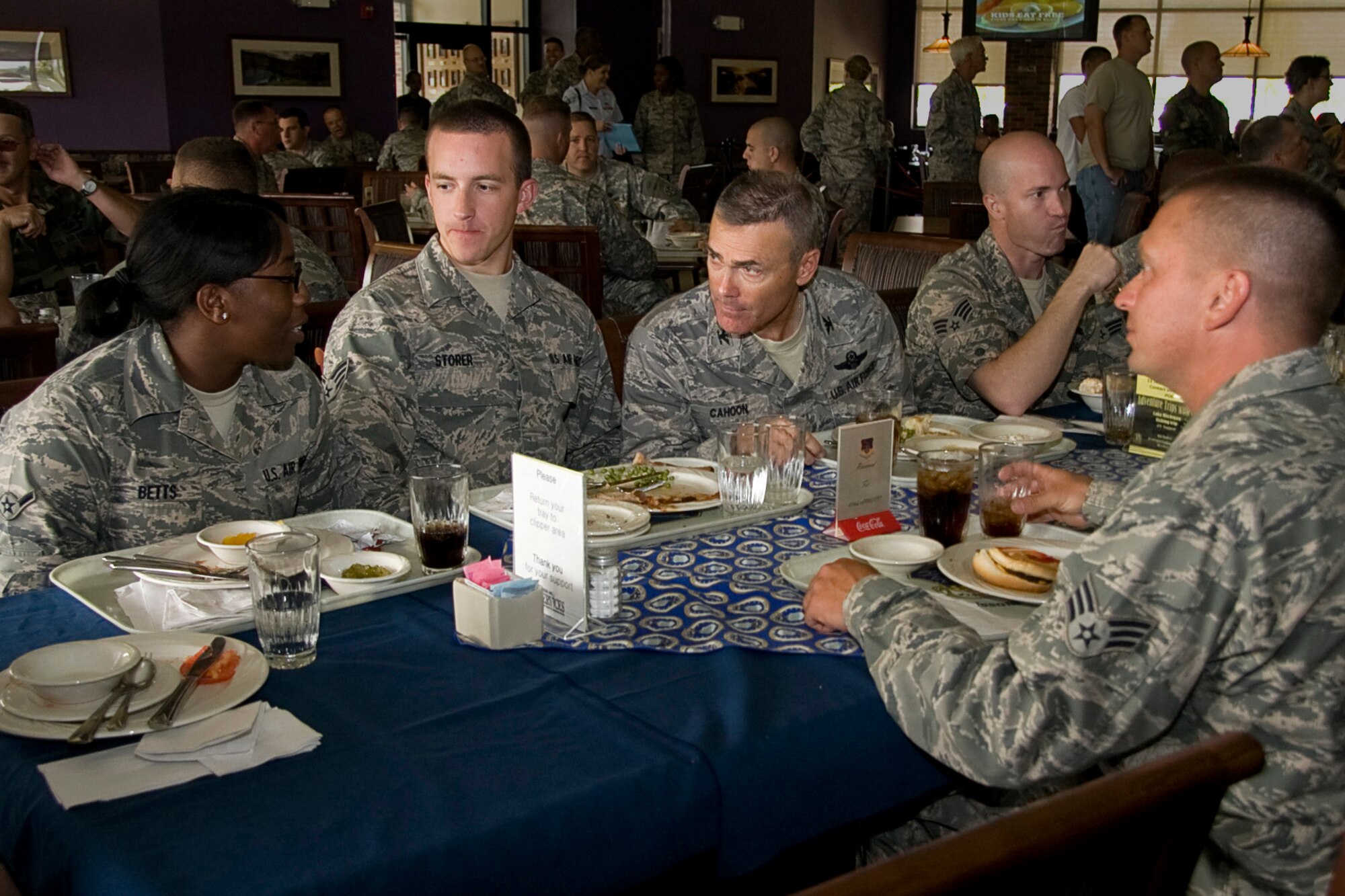 GRISSOM AIR RESERVE BASE, Ind. -- Col. William T. "Tim" Cahoon listens as Airman Tiera Betts explains why she joined the Air Force Reserve. Colonel Cahoon, the 434th Air Refueling Wing commander, hosted a luncheon with several Airmen from maintenance related career fields around Grissom during the August unit training assembly. Airman Betts is a unit personnel apprentice with the 434th Maintenance Operations Flight and joined the Air Force Reserve in 2009. Luncheons similar to this one will be hosted by Colonel Cahoon every UTA with Airmen from different squadrons. (U.S. Air Force photo/Tech. Sgt. Mark R. W. Orders-Woempner)