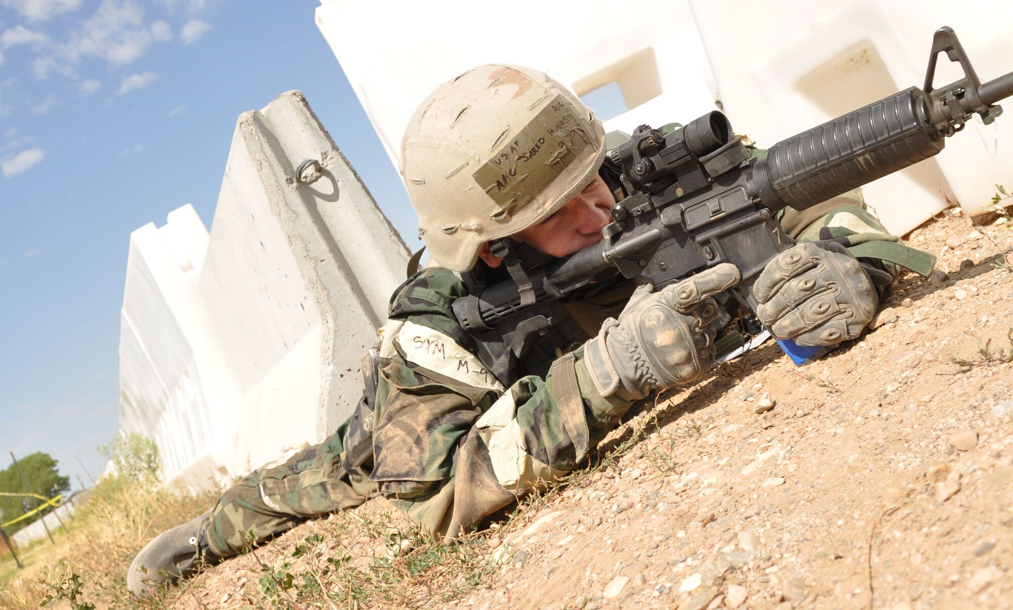 Airman 1st Class Jared Hughes sights in a suspect approaching his entry control point. Airman Hughes and other Airmen from the 419th Security Forces Squadron defended their exercise compound during the wing’s operational readiness exercise Aug. 12. (U.S. Air Force photo/Staff Sgt. Richard Gonzales)