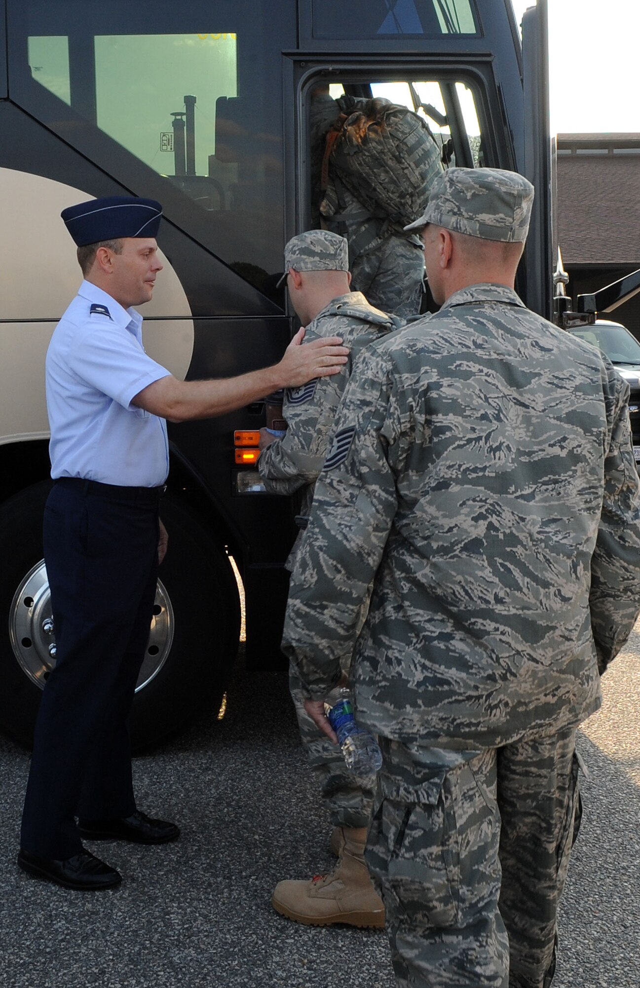 LANGLEY AIRE FORCE BASE, Va. -- Lt. Col. Jeffery Ullman, 633d Civil Engineer Squadron Commander, bids farewell to his Airmen as they depart for a deployment to Afghanistan. A team of CE professionals will be part of the 877th Expeditionary Prime Base Engineer Emergency Force Squadron, tasked with the construction of forward operating bases for U.S. Central Command.  (U.S. Air Force Photo/Staff Sgt. Christina M. Styer)