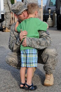 LANGLEY AIRE FORCE BASE, Va. -- Master Sgt. Jason Elftmann, 633d Civil Engineer Squadron operations support superintendent, comforts his son, Trent, before departing on his deployment to Afghanistan.  Sgt. Elftmann other CE professionals are part of the 877th Expeditionary Prime Base Engineer Emergency Force Squadron, tasked with the construction of forward operating bases for U.S. Central Command.  (U.S. Air Force Photo/Staff Sgt. Christina M. Styer)