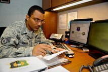 MINOT AIR FORCE BASE, N.D. -- Staff Sgt. Eric Henson, 5th Force Support Squadron base personnel reliability program monitor, inputs information into the Minot AFB PRP tracking database here Aug. 16. Minot is home to the largest PRP program in the Defense Department and home to the only dual-wing, nuclear base in the Air Force. (U.S. Air Force photo by Senior Airman Benjamin Stratton)