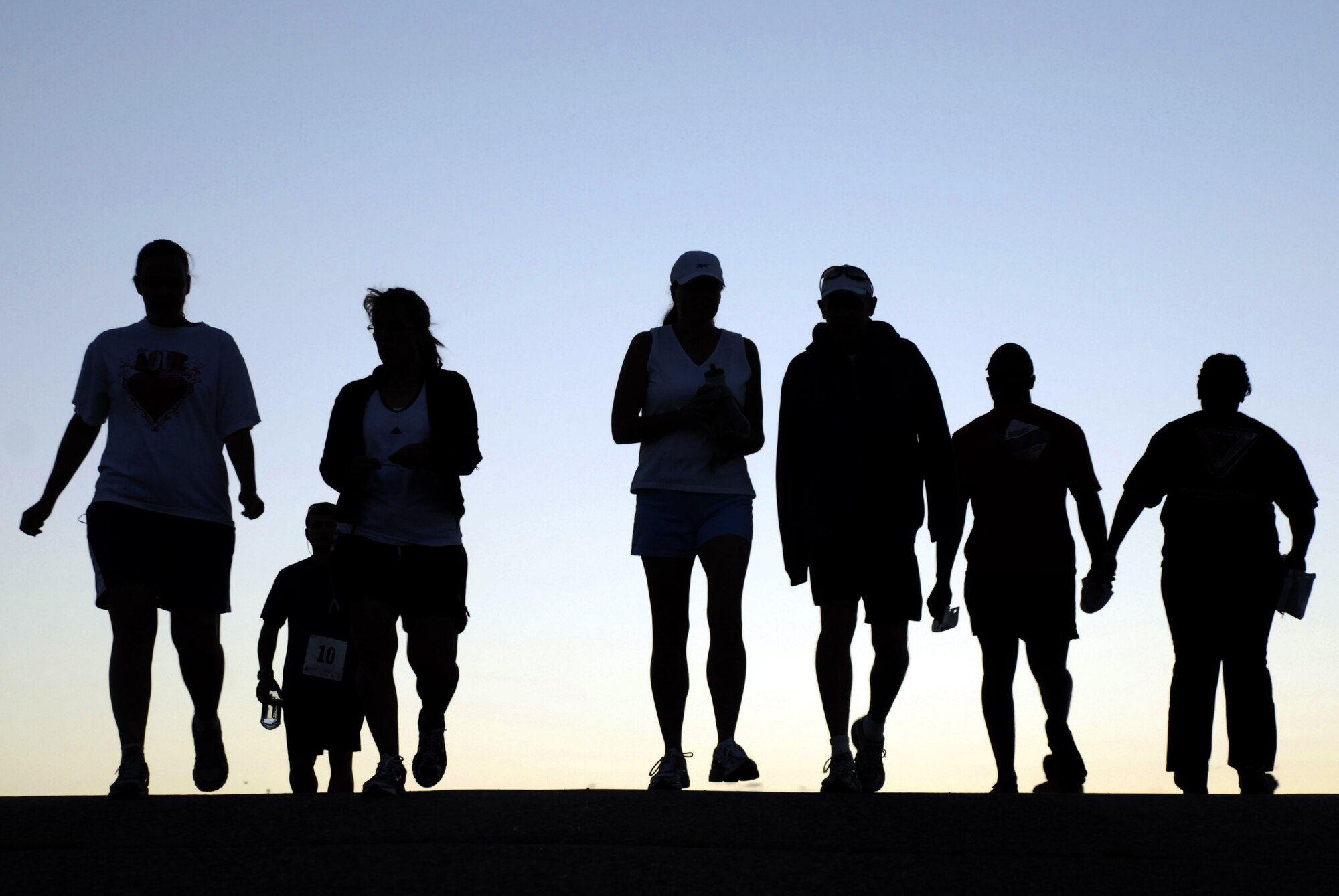 Runners head toward the New Santa Fe Regional Trail at the Air Force Academy in preparation for the Academy's annual half-marathon and 10k races Aug. 14, 2010. Show time for the event was 6 a.m., and the race began at 6:30. (U.S. Air Force photo/Mike Kaplan)