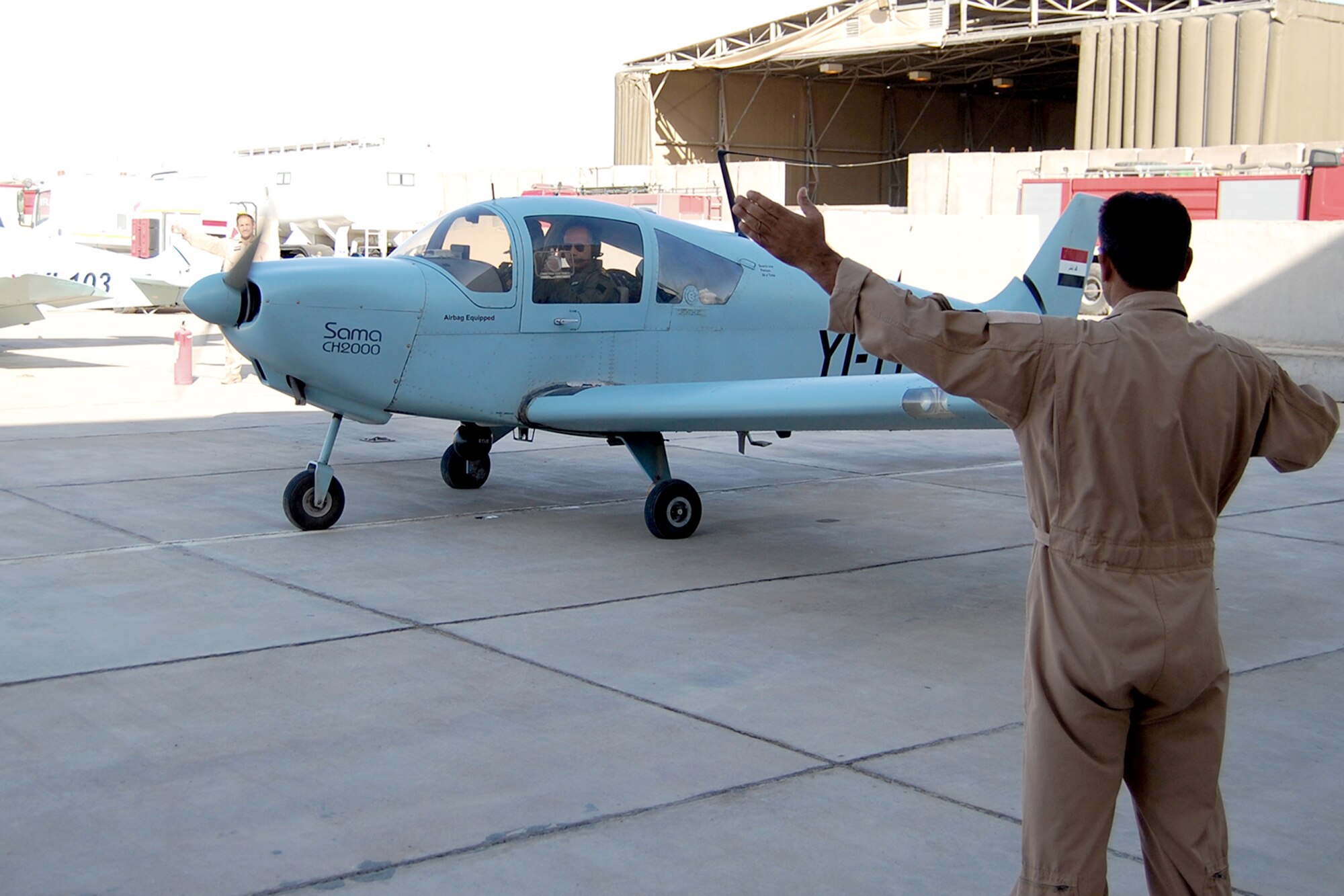 Iraqi Brig. Gen. Sami Saeed gives a thumbs-up from inside a 70th Squadron CH 2000 reconnaissance airplane June 27, 2010, at Contingency Operating Base Basra, Iraq, before departing on a joint mission with U.S. forces. The Electronic Systems Center is completing an information technology infrastructure project that will significantly improve communication and connectivity for the Iraqi Air Force. (U.S. Army photo/Sgt. Benjamin Kibbey)