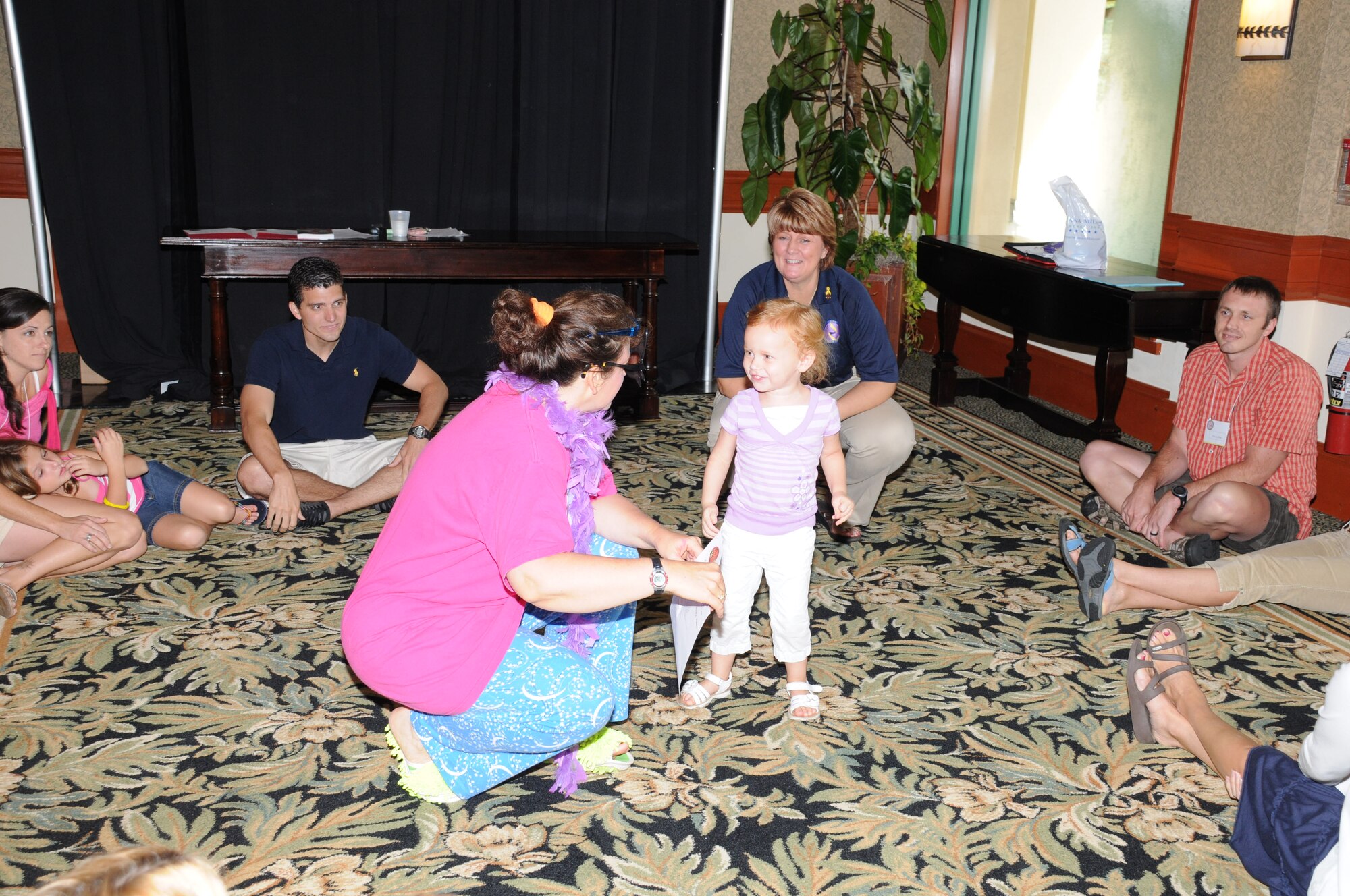 Author Claire Foltz, in disguise as "Fannie Francis", talks with Megan Olsen during "Operation Story Tag" during the Yellow Ribbon Conference. (U.S. Air Force Photo by Capt. Shane Huff).