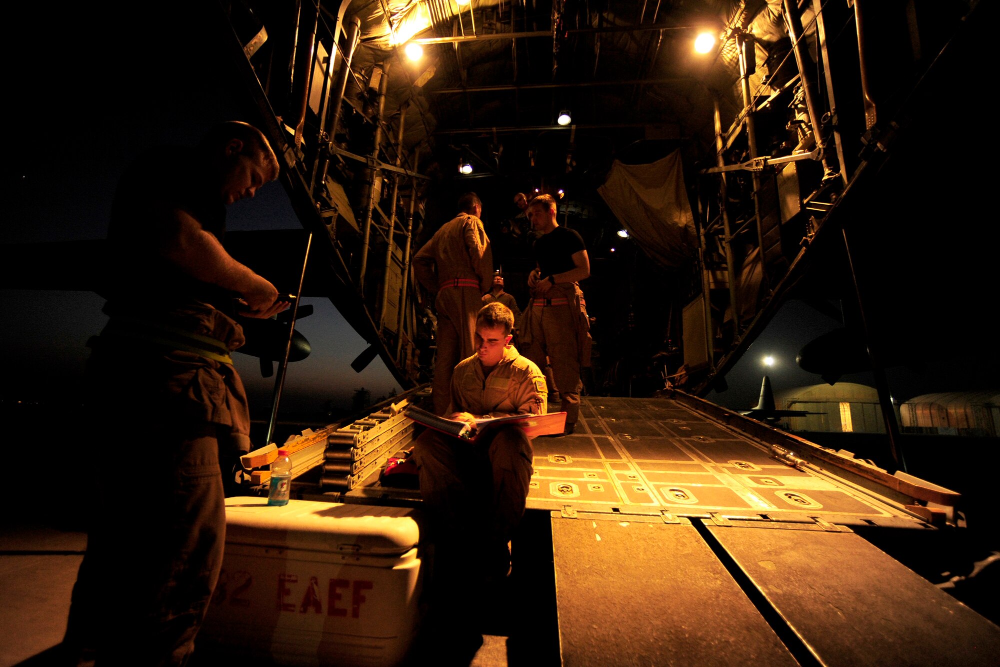 A loadmaster assigned to the 777th Expeditionary Airlift Squadron reviews a per-flight inspection checklist prior to an aeromedical evacuation mission July 17, 2010, at Joint Base Balad, Iraq. (U.S. Air Force photo/Staff Sgt. Andy M. Kin) 

