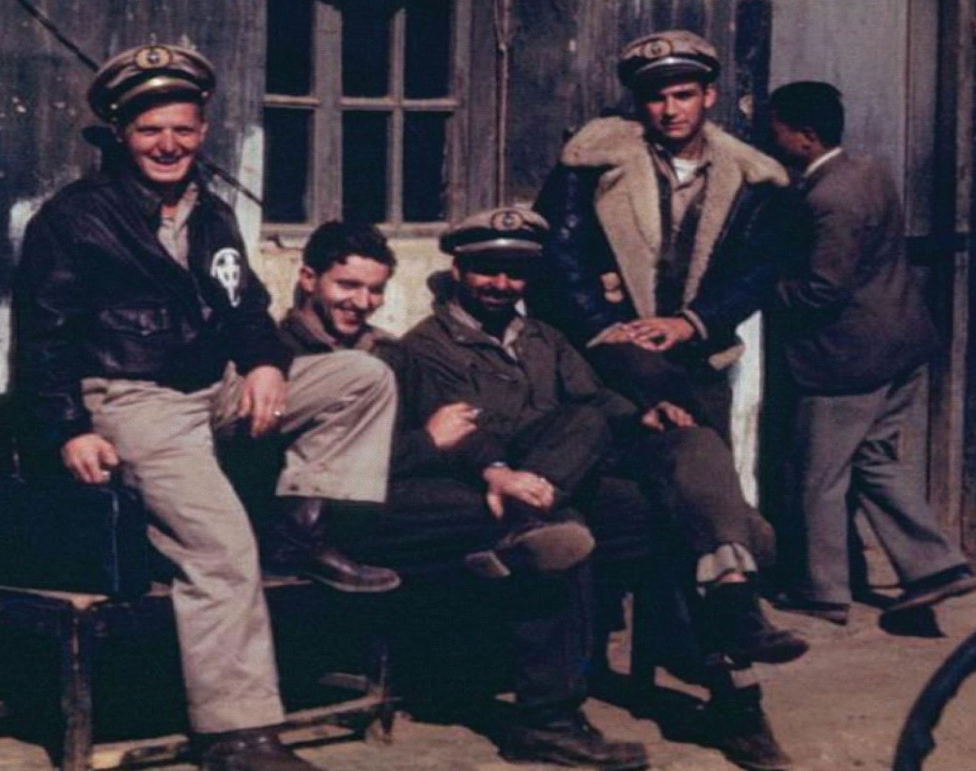 China National Aviation Corporation (CNAC) cargo crews wore a variety of uniform items. Capt. Steve Kusak (left) is wearing the typical flight uniform of khaki shirt and pants, Wellington boots, USAAF A-2 leather flight jacket with "Chung," and CNAC uniform hat. The others are using USAAF A-4 flight suits over their uniforms with a B-3 flight jacket being worn on the right. (Photo courtesy of cnac.org)