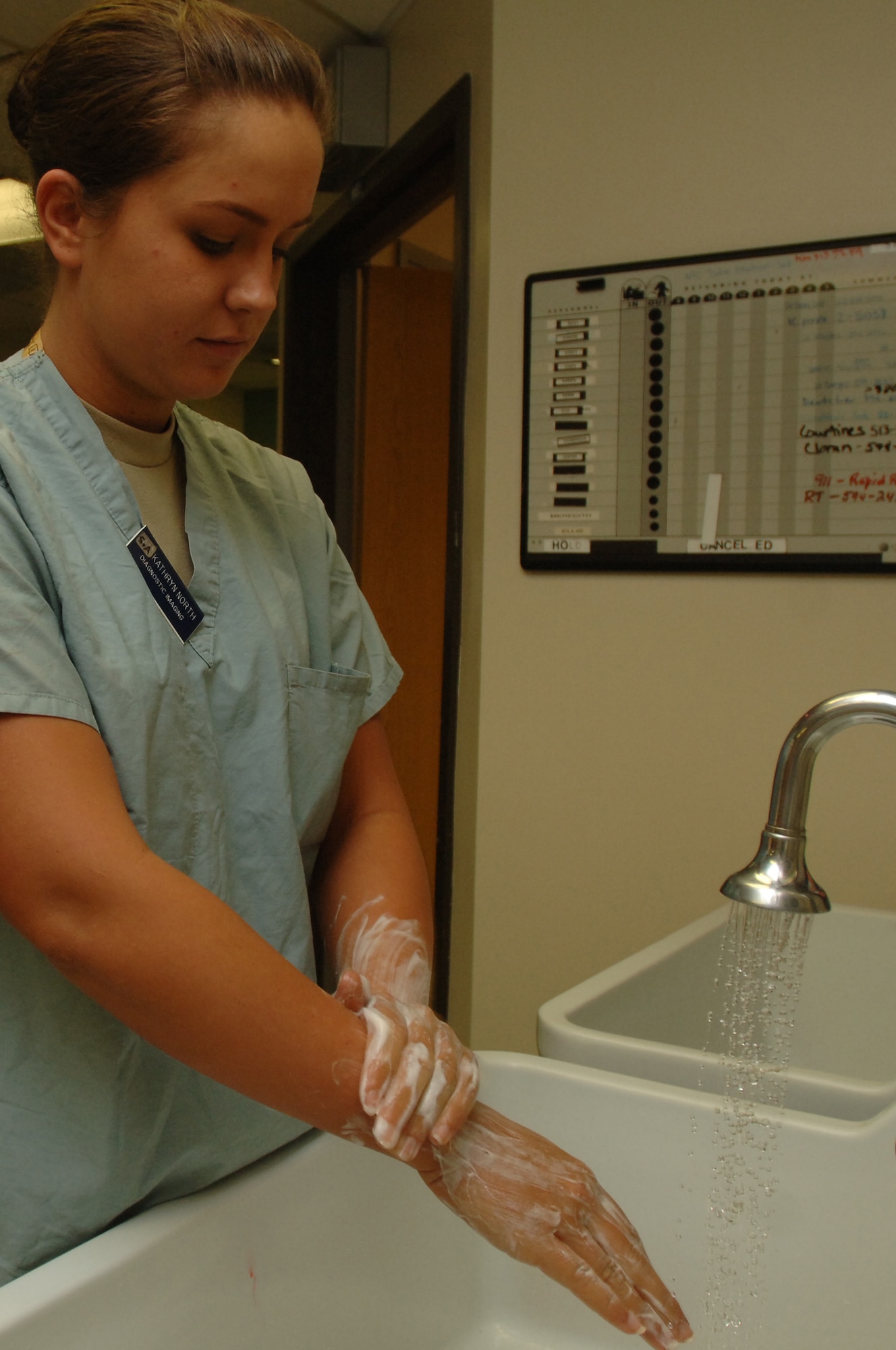 Senior Airman Kathryn North, Radiologic Technologist, 59th Radiology Squadron, washes her hands before assisting with a procedure at Wilford Hall Medical Center, Lackland Air Force Base, Texas.  (U.S. Air Force photo by Senior Airman Nicole Mickle)